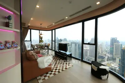 Luxurious high-rise living room with panoramic city views and modern decor.