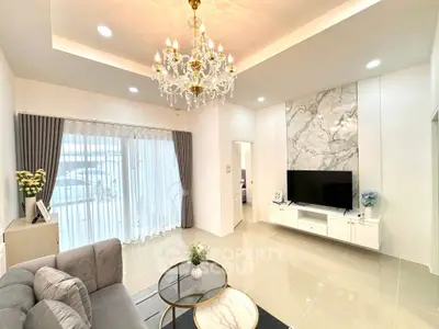 Elegant living room with chandelier and modern decor