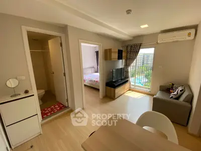 Modern apartment interior with living room, bedroom, and balcony view