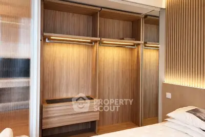 Modern bedroom with elegant wooden wardrobe and ambient lighting