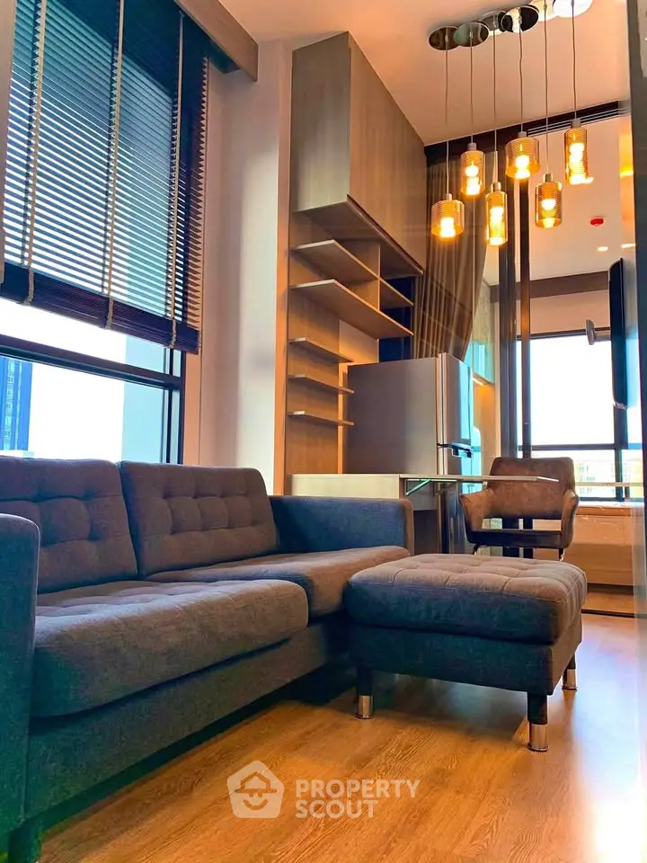 Modern living room with stylish furniture and elegant lighting in a contemporary apartment.