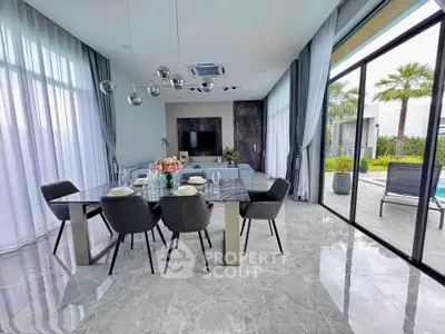 Luxurious modern dining and living area with pool view and elegant decor
