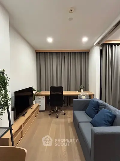 Modern living room with sleek furniture and natural light, perfect for urban living.