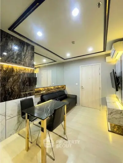 Modern kitchen with sleek design and open layout, featuring high-end appliances and stylish lighting.