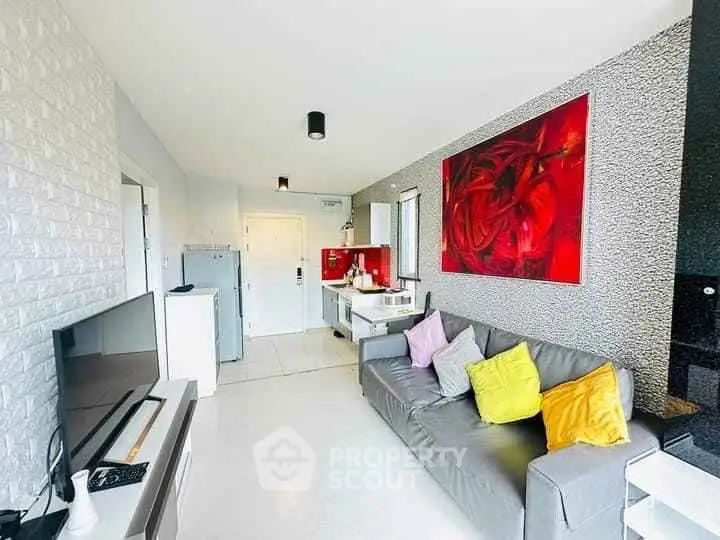 Modern living room with vibrant decor and open kitchen layout