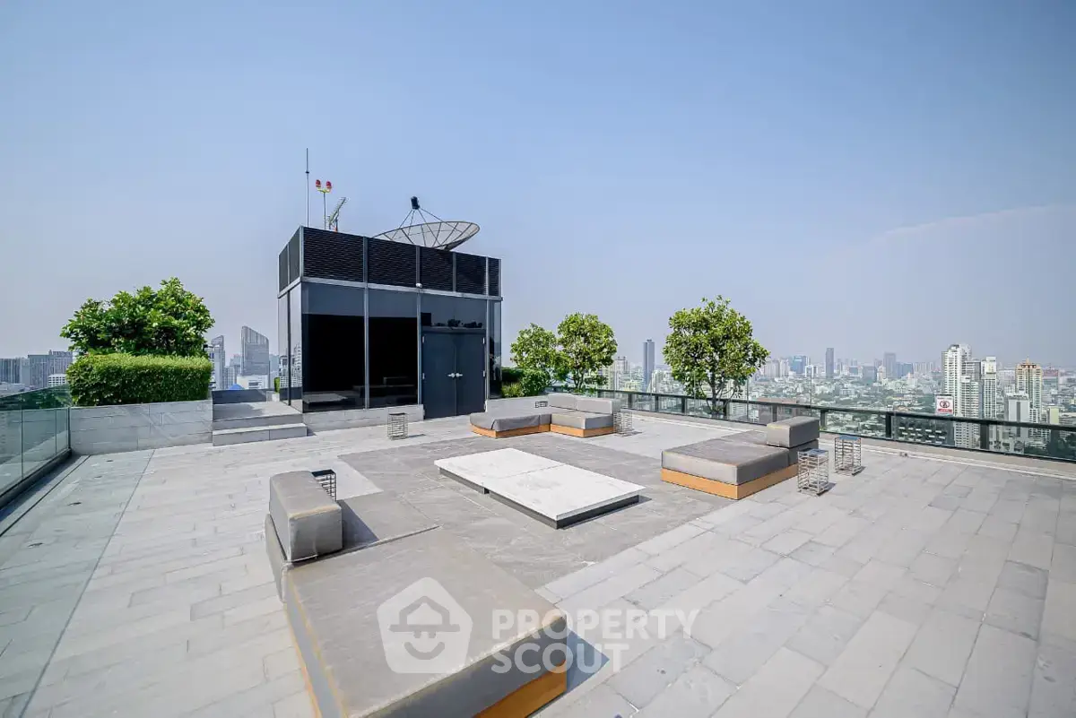 Stunning rooftop terrace with panoramic city views and modern seating area.