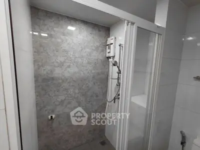 Modern bathroom with sleek shower and elegant tile design