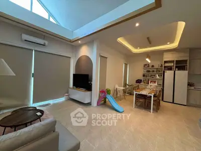 Spacious modern living room with high ceiling and open dining area