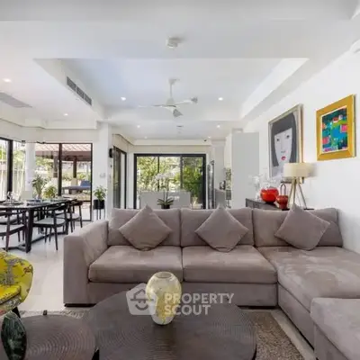 Spacious modern living room with elegant decor and open layout, perfect for entertaining.