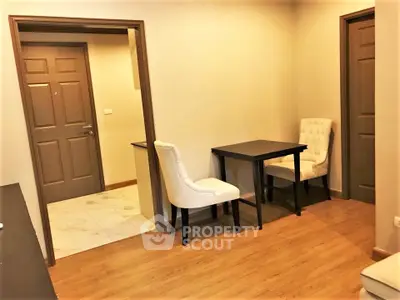 Cozy apartment corner with elegant dining setup and wooden flooring