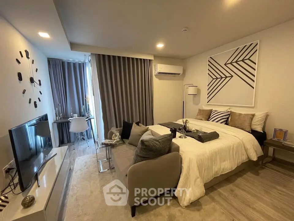 Modern bedroom with stylish decor and natural light