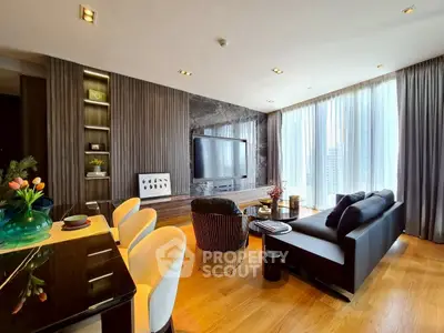 Luxurious modern living room with elegant decor and large windows offering city views.