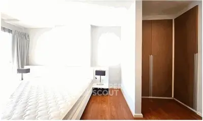Bright bedroom with wooden flooring and built-in wardrobe