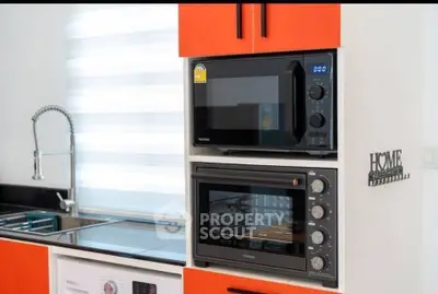 Modern kitchen with sleek appliances and stylish cabinetry
