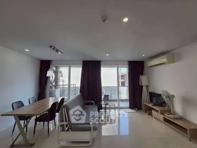 Spacious living room with modern furniture and natural light