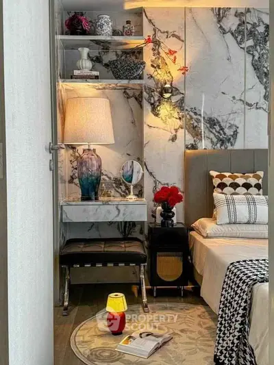 Luxurious bedroom with marble accents and elegant decor, featuring a cozy reading nook and ambient lighting.