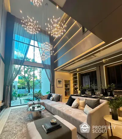 Luxurious modern living room with high ceilings and elegant lighting