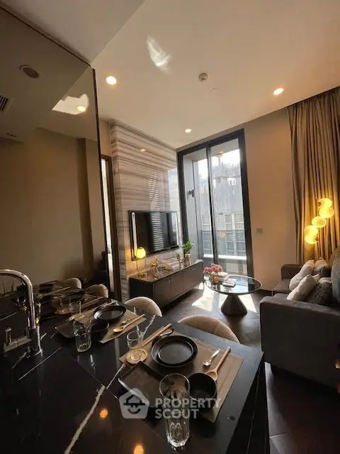 Modern living room with elegant decor and city view from large windows.
