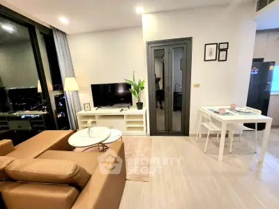 Modern living room with city view, stylish furniture, and open layout in high-rise apartment.