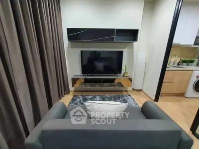 Modern living room with sleek furniture and integrated kitchen area