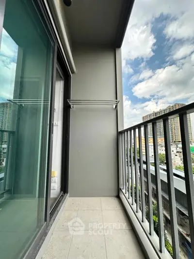Modern balcony with city view, perfect for relaxation and enjoying the skyline.