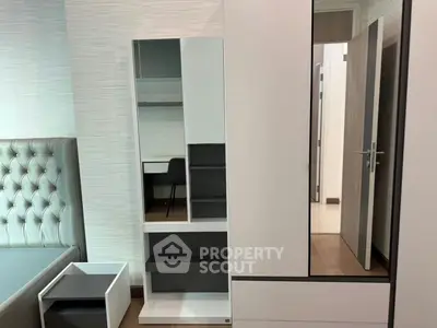 Modern bedroom with stylish furniture and sleek design elements