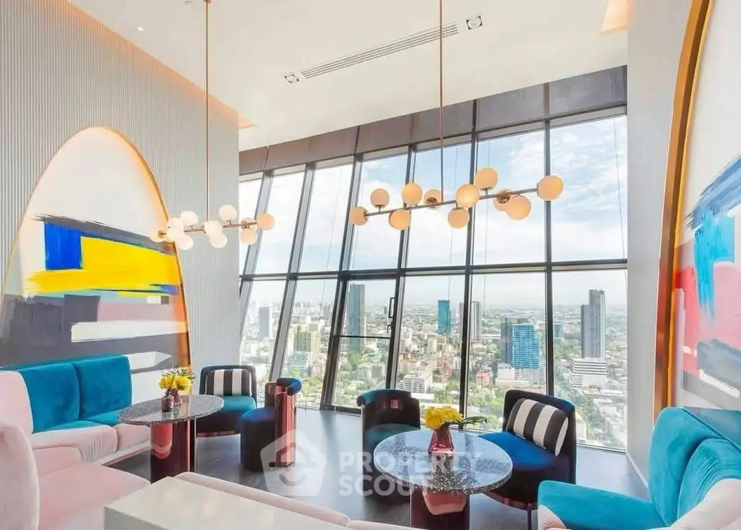 Luxurious high-rise living room with panoramic city views and modern decor.