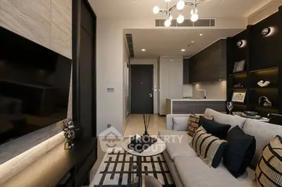 Modern living room with stylish decor and open kitchen layout