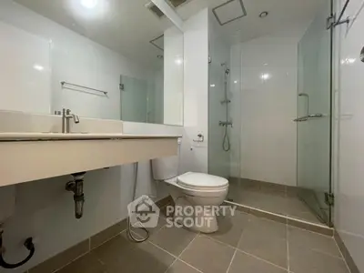 Modern bathroom with glass shower and sleek fixtures