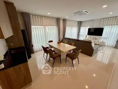 Spacious modern living room with elegant dining area and natural light