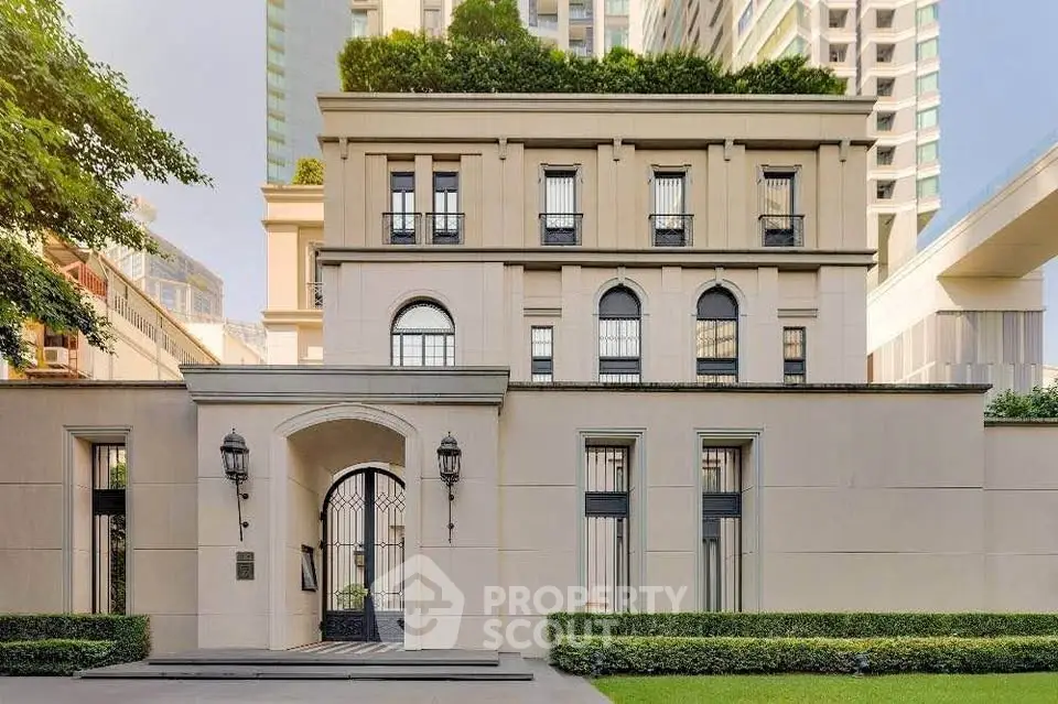 Elegant urban building facade with classic architecture and lush greenery, perfect for luxury living.