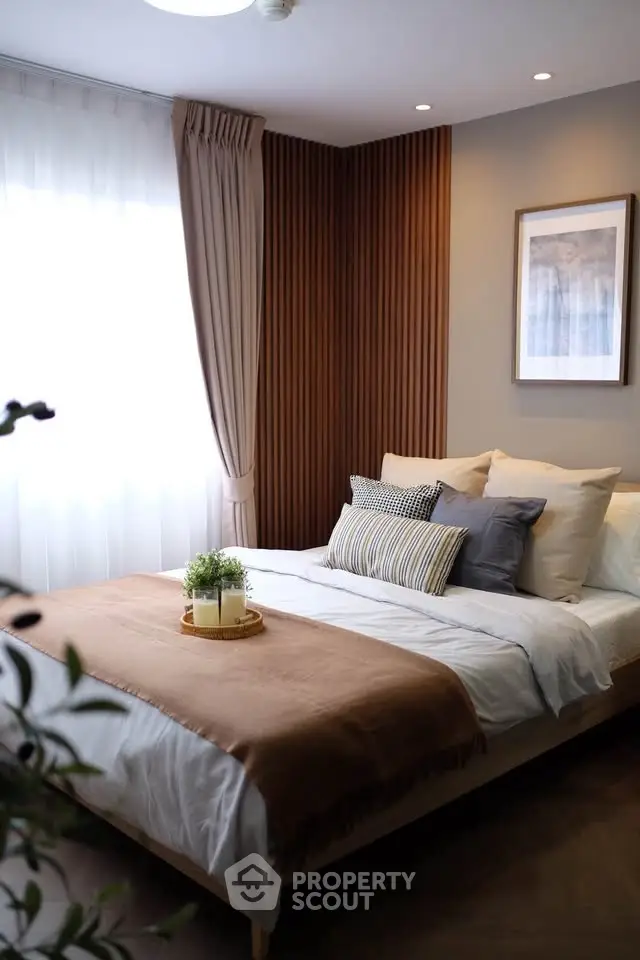 Cozy modern bedroom with elegant decor and natural light