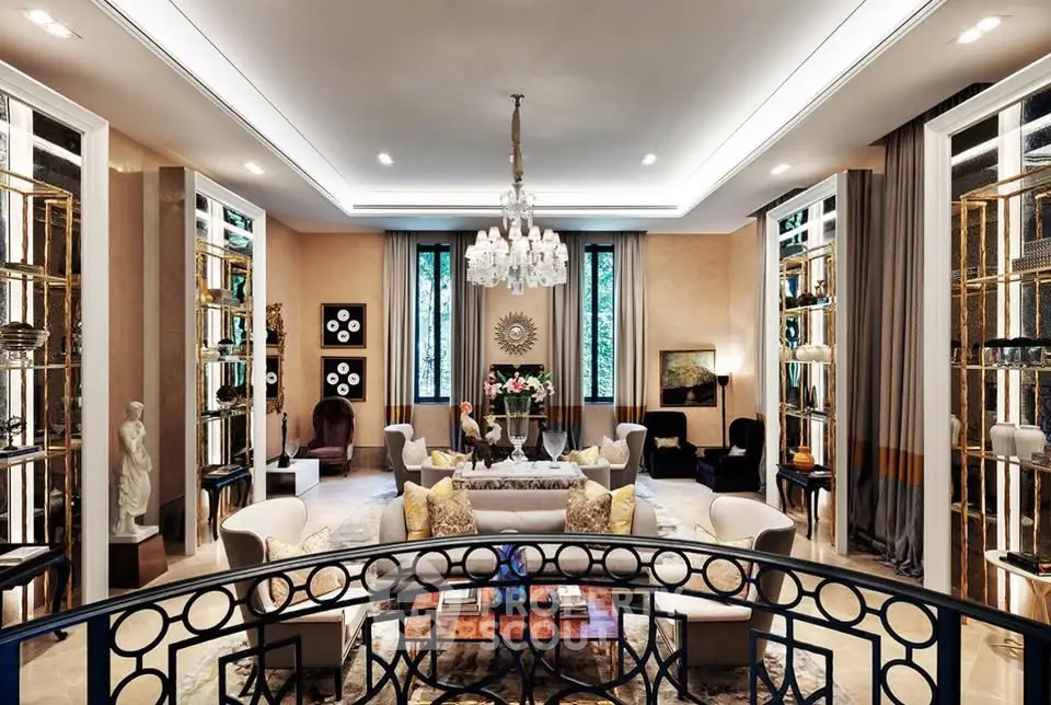 Luxurious living room with elegant decor and chandelier, showcasing opulent design and spacious layout.