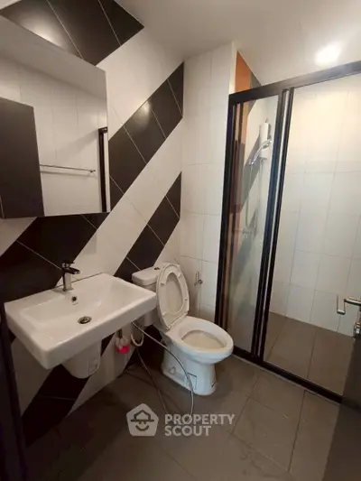 Modern bathroom with sleek design and glass shower enclosure