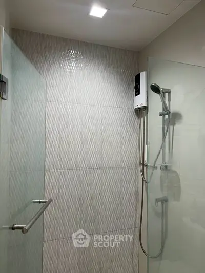 Modern bathroom with glass shower enclosure and sleek design