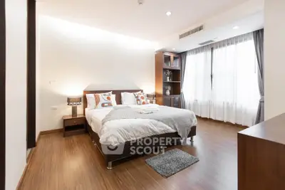 Spacious modern bedroom with elegant decor and natural light