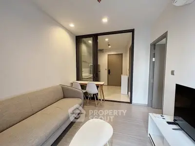 Modern living room with sleek furniture and open layout in a contemporary apartment.