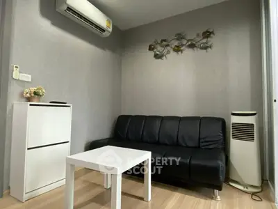 Cozy living room with modern decor and air conditioning