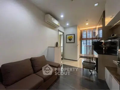Modern living room with sleek kitchen in open layout apartment