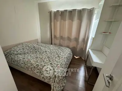 Cozy bedroom with floral bedding and natural light through curtains, perfect for restful nights.