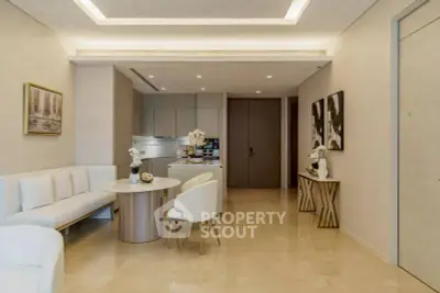 Elegant modern living room with open kitchen, featuring sleek furniture and soft lighting.