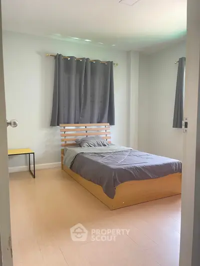 Cozy bedroom with modern wooden bed and soft lighting