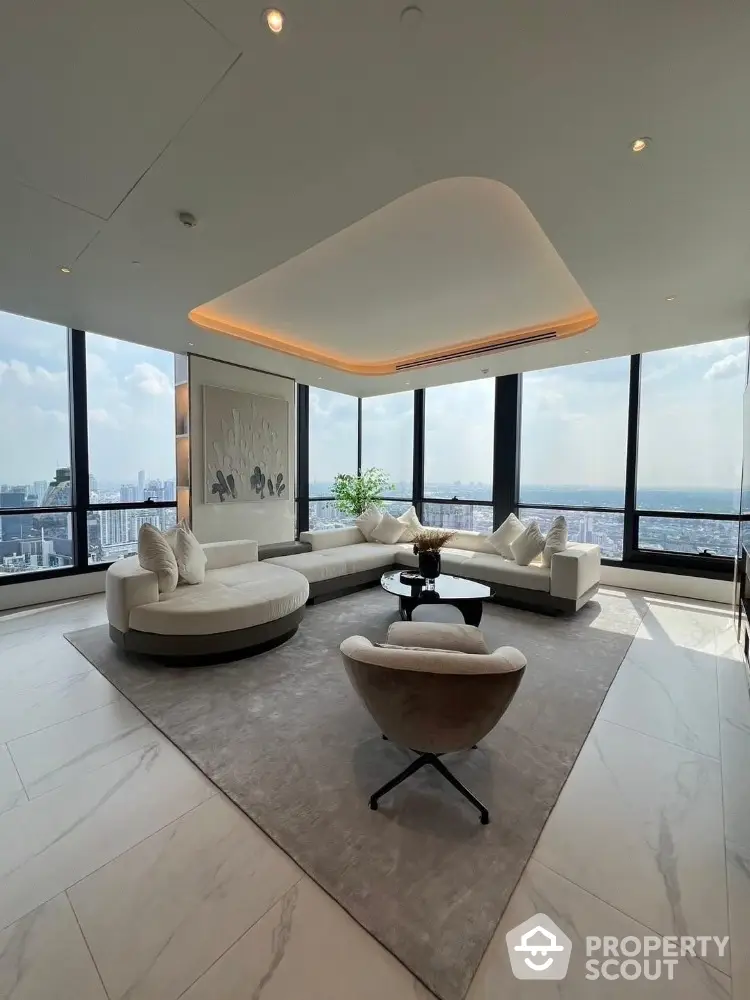 Luxurious high-rise living room with panoramic city views and modern furnishings.