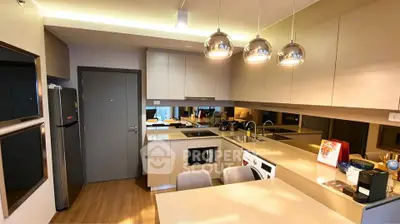 Modern kitchen with sleek cabinetry, integrated appliances, and stylish lighting in a contemporary apartment.