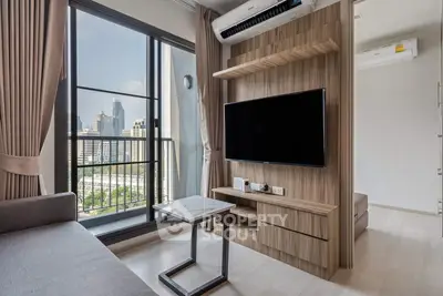 Modern living room with city view, featuring sleek furniture and large window.
