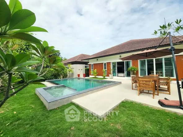 Luxurious villa with private pool and lush garden, perfect for relaxation and entertaining.