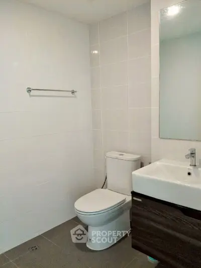 Modern bathroom with sleek fixtures and minimalist design.