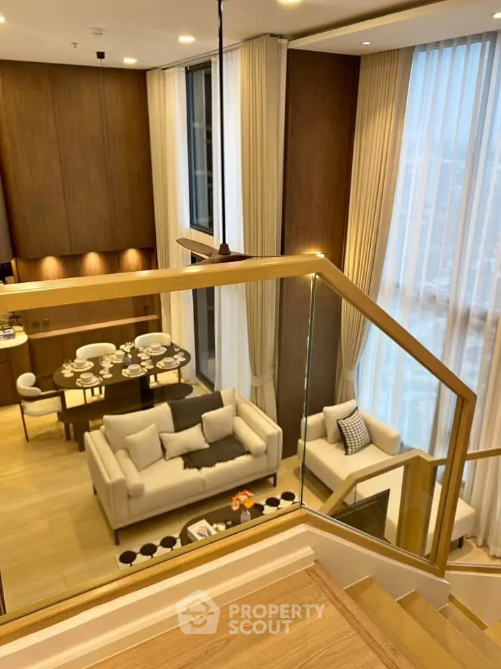 Luxurious modern living room with high ceilings and elegant decor