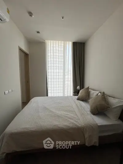 Modern bedroom with natural light and minimalist decor