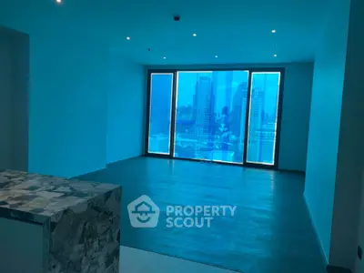 Spacious modern living room with stunning city view through large windows.